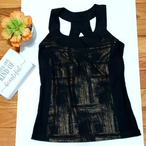 Xersion metallic gold and black active top